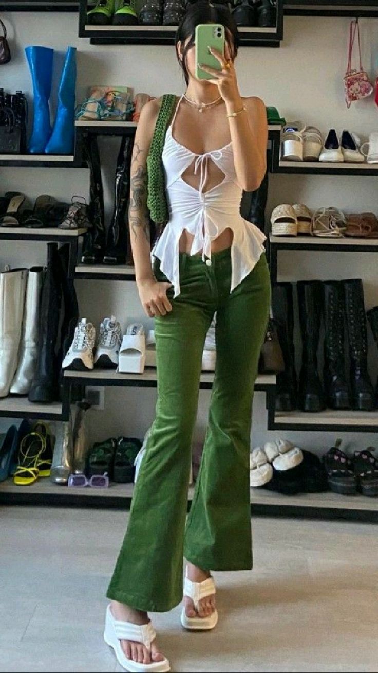 green corduroy flared pants and white platform sandals